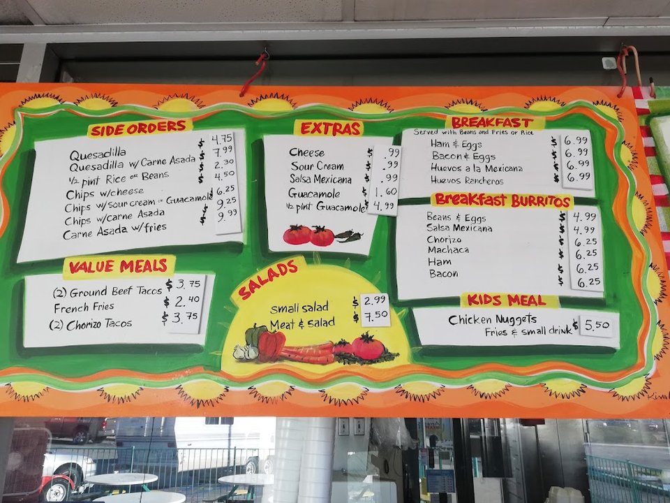 Printed menu with breakfast burritos and tacos.