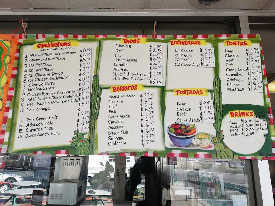Printed menu with breakfast burritos and tacos.
