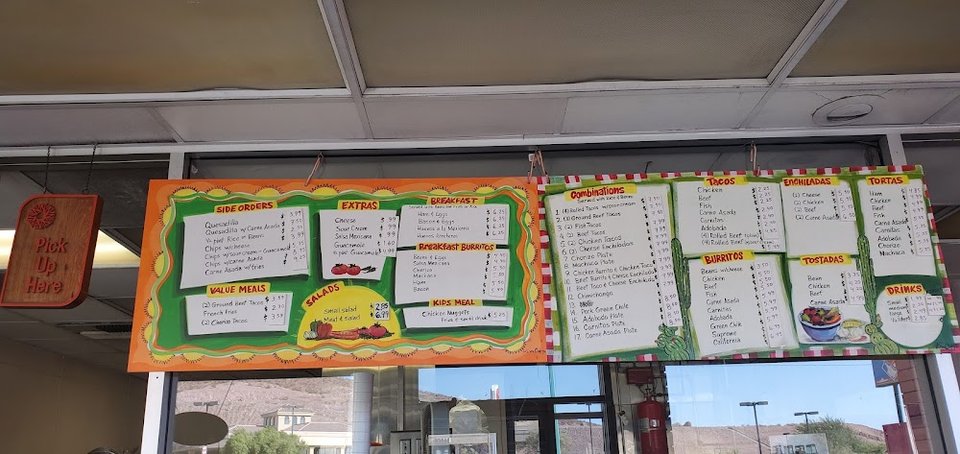 Menu board showing value meals and side orders.