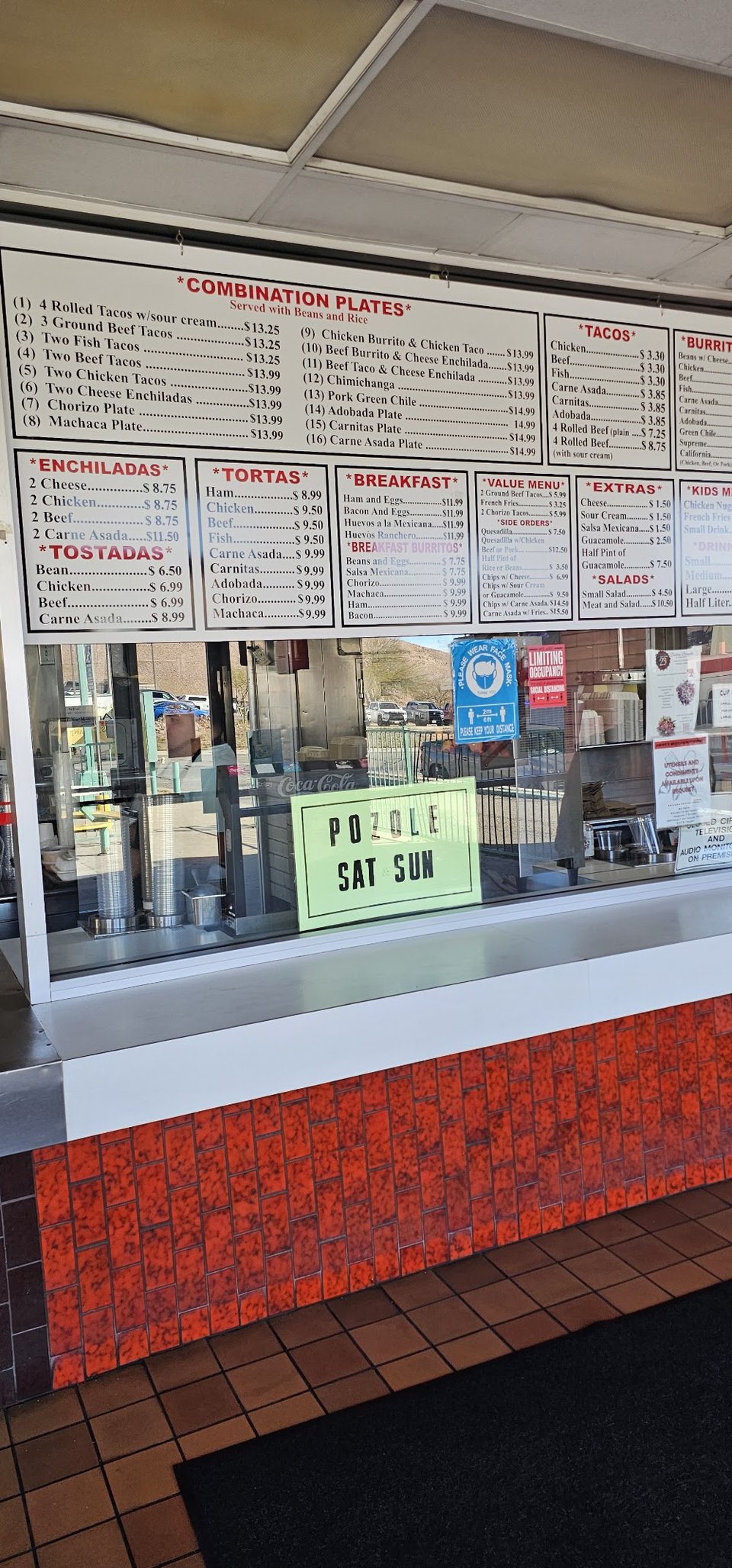 Restaurant menu featuring salads, combinations, and kids meals.
