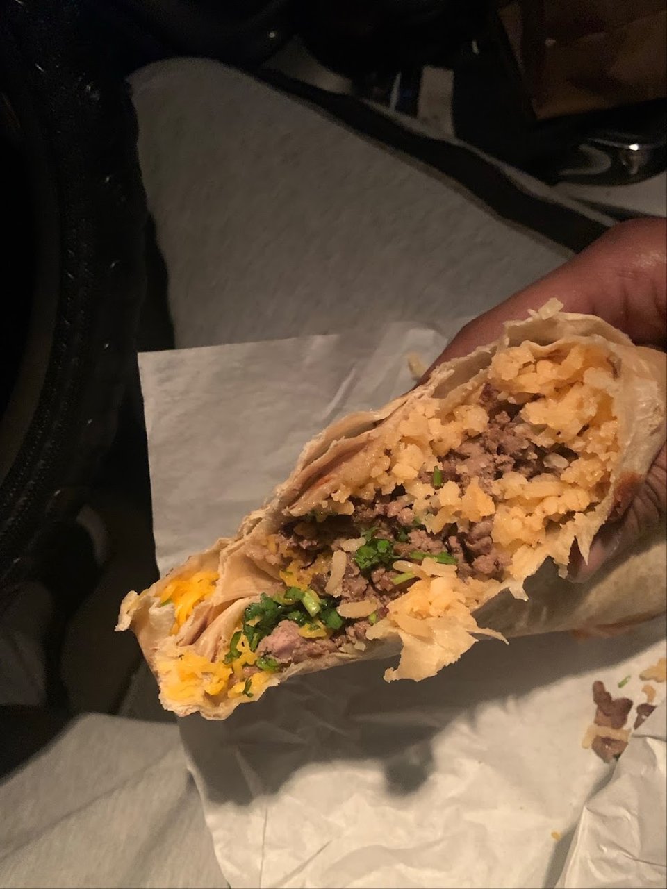Printed menu with breakfast burritos and tacos.
