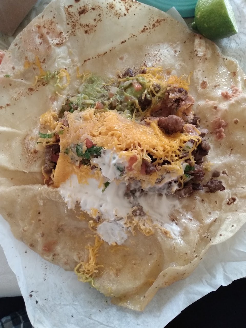 Printed menu with breakfast burritos and tacos.